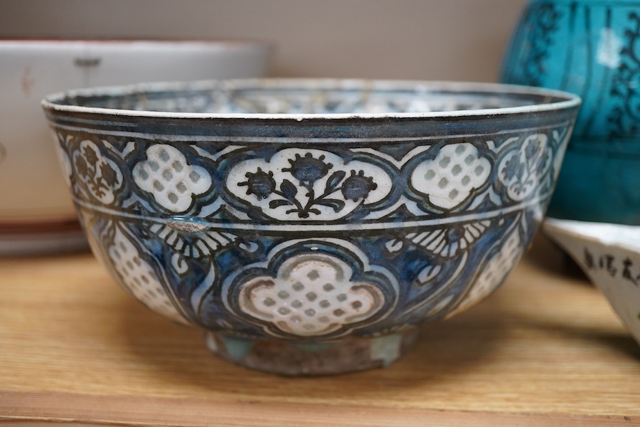 An early Persian pottery bowl and vase, a Japanese bowl and another Chinese segment dish, tallest 20cm